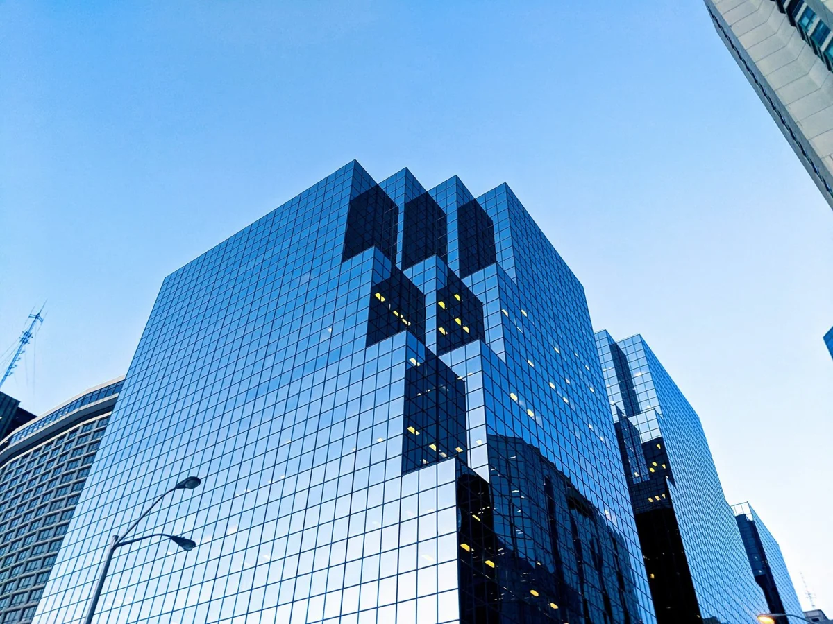 Glass office tower viewed from street level