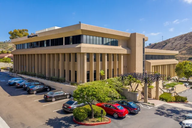 Office building with landscaped grounds and parking