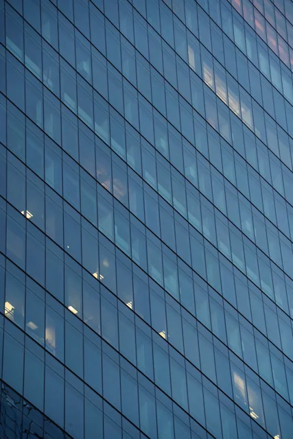 Illustrative glass facade of a commercial office building